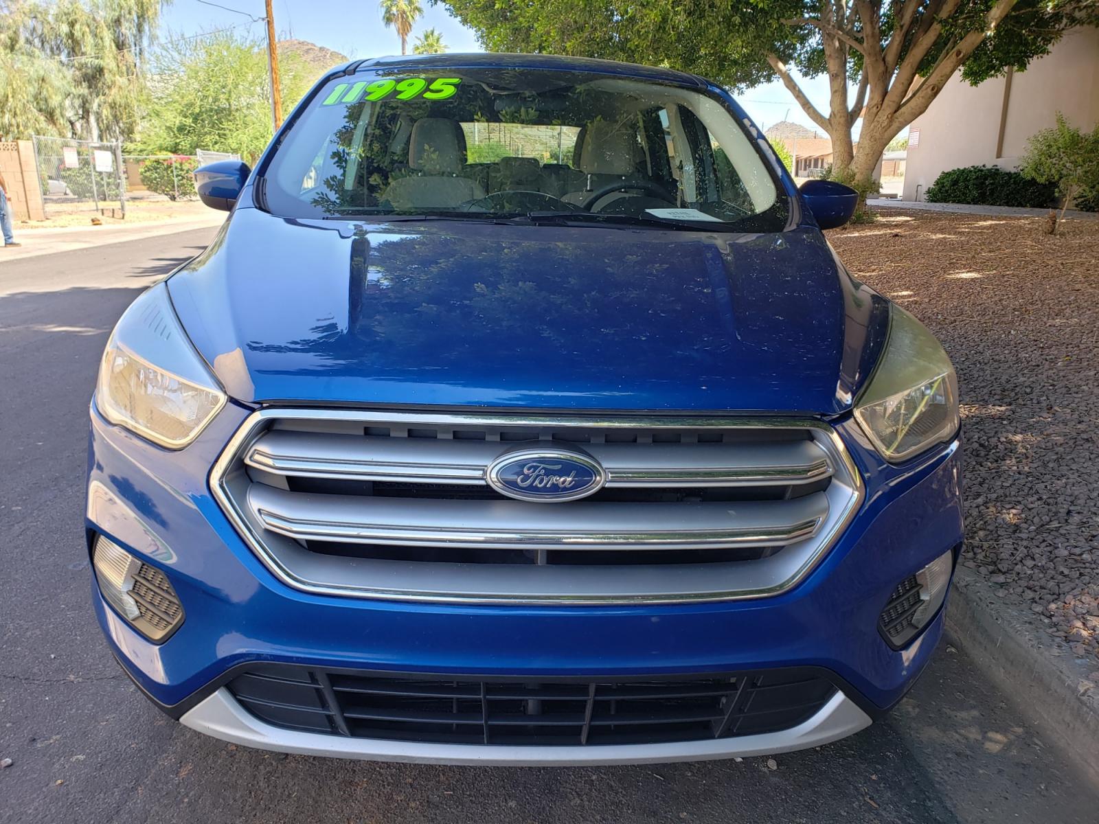 2017 /Tan and black Ford Escape SE FWD ( 1FMCU0GD4H) with an 1.5L L4 DOHC 16V engine, 6A transmission, located at 323 E Dunlap Ave., Phoenix, AZ, 85020, (602) 331-9000, 33.567677, -112.069000 - 2017 Ford Escape SE,.......EXCELLENT condition, ONLY 125K MILES!!.... Ice Cold A/C, Black and tan interior with tan cloth seats in near perfect condition, New Tires, New brakes, Tune up, Stereo/CD Player, Bluetooth, Phone sync, Backuup camera, Satellite compatible, This suv is gorgeous inside and ou - Photo #1