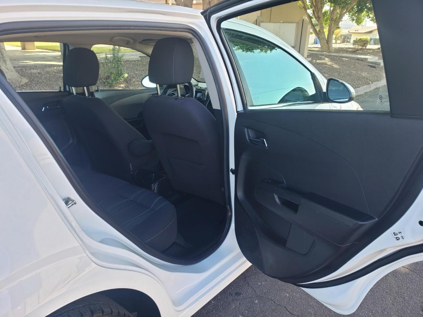 2015 WHITE /gray and black Chevrolet Sonic LT Auto 5-Door (1G1JC6SH3F4) with an 1.8L L4 DOHC 24V engine, 6-Speed Automatic transmission, located at 323 E Dunlap Ave., Phoenix, AZ, 85020, (602) 331-9000, 33.567677, -112.069000 - 2015 Chevrolet Sonic LT Auto 5-Door, ........A Must See!! No accidents, Ice cold AC. The car is gorgeous inside and out. Power windows, Power door locks, Stereo/Cd player, Phone sync, Bluetooth, Satellite compatible, Beautiful gray and black interior with gray cloth seats, Incredible gas mileage! C - Photo#14