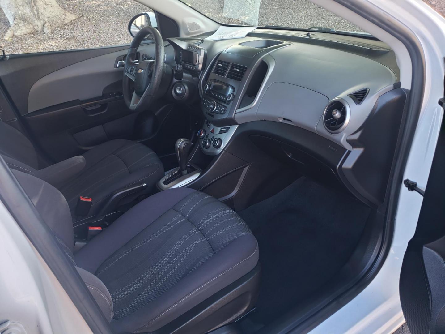 2015 WHITE /gray and black Chevrolet Sonic LT Auto 5-Door (1G1JC6SH3F4) with an 1.8L L4 DOHC 24V engine, 6-Speed Automatic transmission, located at 323 E Dunlap Ave., Phoenix, AZ, 85020, (602) 331-9000, 33.567677, -112.069000 - 2015 Chevrolet Sonic LT Auto 5-Door, ........A Must See!! No accidents, Ice cold AC. The car is gorgeous inside and out. Power windows, Power door locks, Stereo/Cd player, Phone sync, Bluetooth, Satellite compatible, Beautiful gray and black interior with gray cloth seats, Incredible gas mileage! C - Photo#13