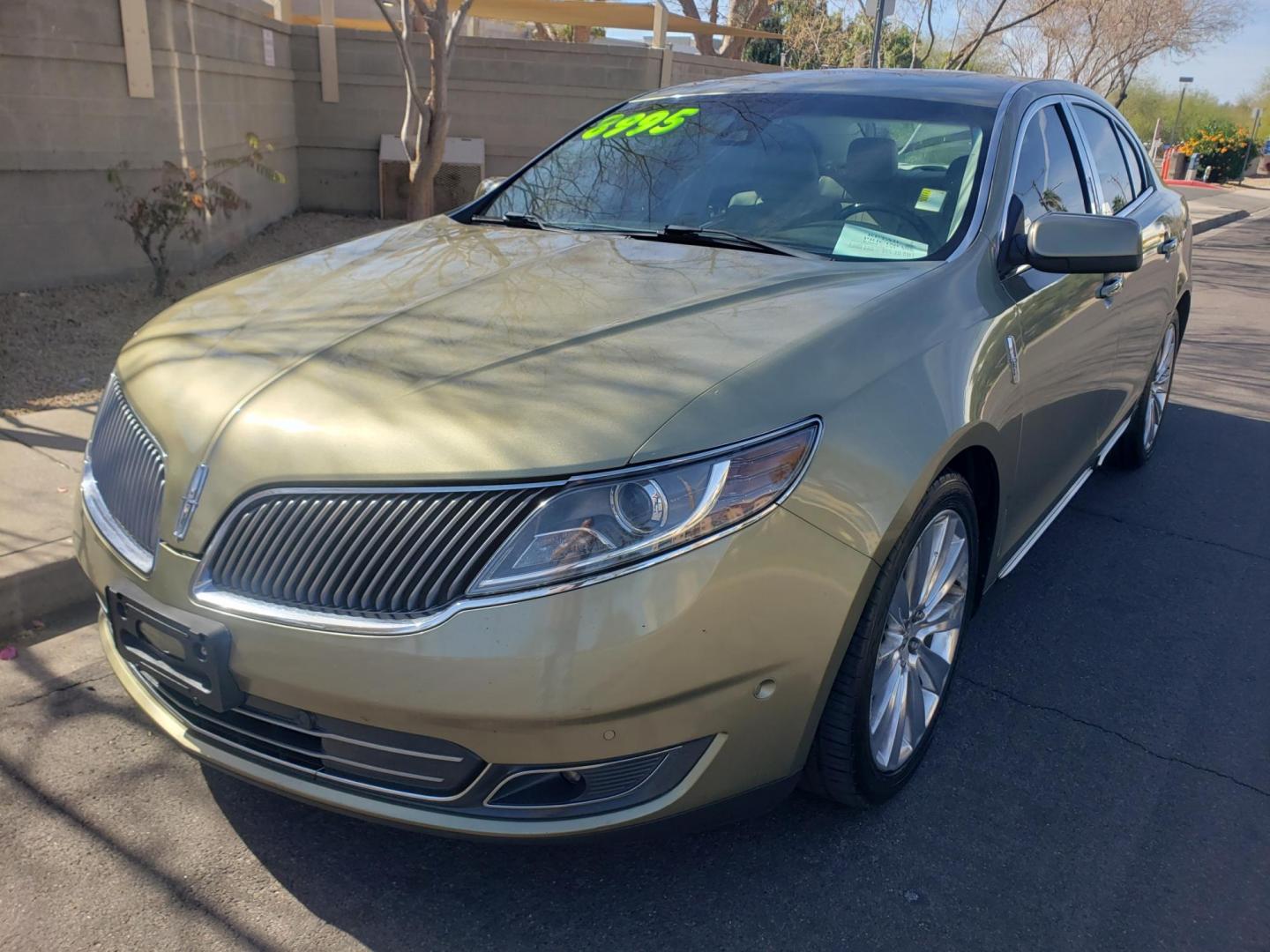 2013 gold /Tan and black Lincoln MKS EcoBoost AWD (1LNHL9FT6DG) with an 3.5L V6 DOHC 24V engine, 6-Speed Automatic transmission, located at 323 E Dunlap Ave., Phoenix, AZ, 85020, (602) 331-9000, 33.567677, -112.069000 - 2013 Lincoln MKS EcoBoost AWD,......A True Must See!! No accidents, IceCold AC, The car is gorgeous inside and out, power windows, power door locks, Gorgeous tinted sunroof, touch screen Stereo/Cd Player, Navigation, Phone sync, Bluetooth, Satellite radio compatible, Backup camera, Clean tan and gra - Photo#0