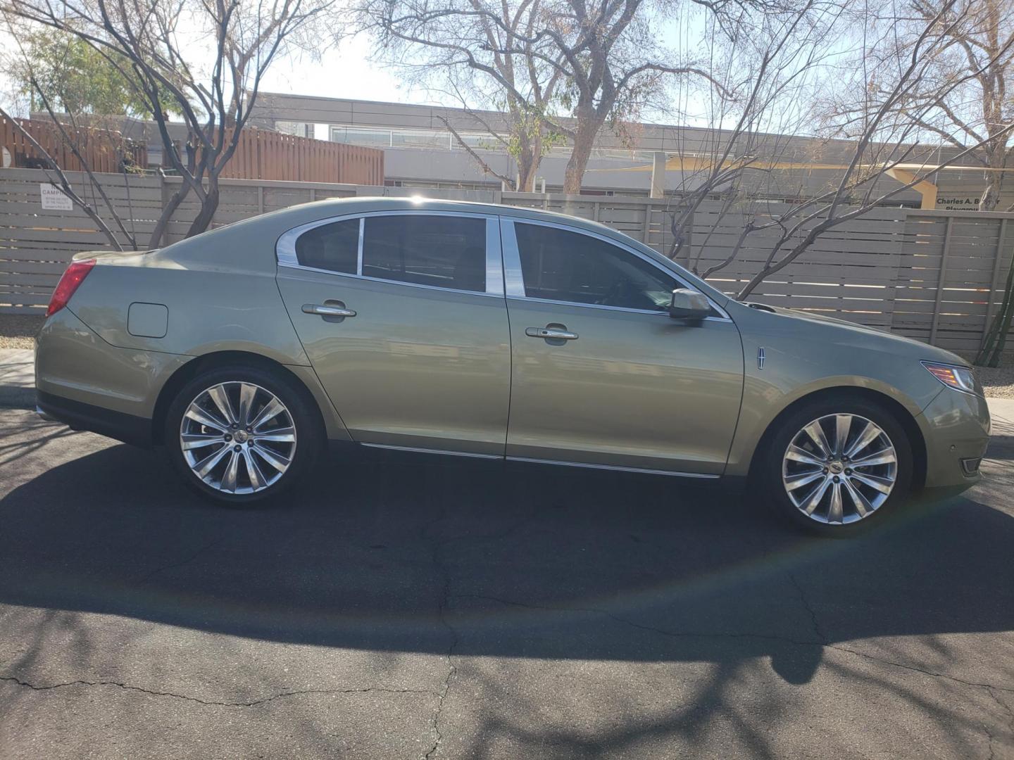 2013 gold /Tan and black Lincoln MKS EcoBoost AWD (1LNHL9FT6DG) with an 3.5L V6 DOHC 24V engine, 6-Speed Automatic transmission, located at 323 E Dunlap Ave., Phoenix, AZ, 85020, (602) 331-9000, 33.567677, -112.069000 - 2013 Lincoln MKS EcoBoost AWD,......A True Must See!! No accidents, IceCold AC, The car is gorgeous inside and out, power windows, power door locks, Gorgeous tinted sunroof, touch screen Stereo/Cd Player, Navigation, Phone sync, Bluetooth, Satellite radio compatible, Backup camera, Clean tan and gra - Photo#4
