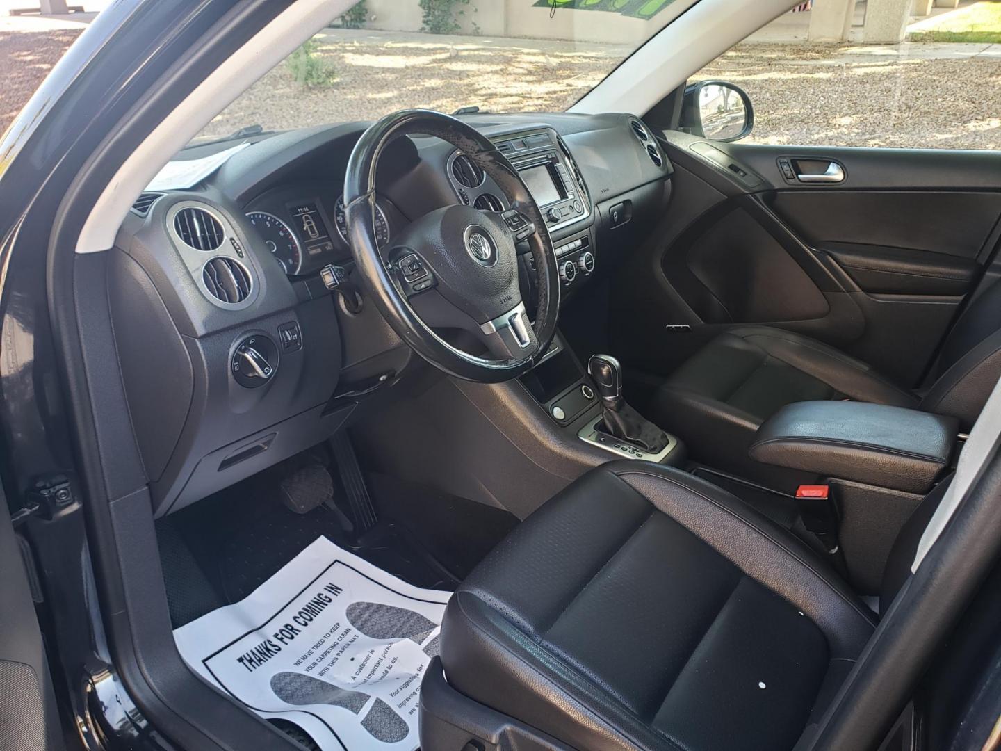 2015 black /gray and black Volkswagen Tiguan S 4Motion (WVGBV7AX9FW) with an 2.0L L4 DOHC 16V TURBO engine, 6-Speed Automatic transmission, located at 323 E Dunlap Ave., Phoenix, AZ, 85020, (602) 331-9000, 33.567677, -112.069000 - 2015 Volkswagen Tiguan S 4Motion,.......EXCELLENT condition,.... Ice Cold A/C, Black and gray interior with black leather seats in near perfect condition, Stereo/CD Player, Bluetooth, Phone sync, Backup camera, Satellite compatible, Navigation, Gorgeous tinted sunroof, This suv is gorgeous inside an - Photo#9