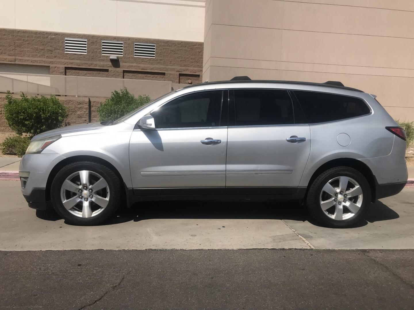 2014 silver /gray and black Chevrolet Traverse LTZ FWD (1GNKRJKD1EJ) with an 3.6L V6 DOHC 24V engine, 6-Speed Automatic transmission, located at 323 E Dunlap Ave., Phoenix, AZ, 85020, (602) 331-9000, 33.567677, -112.069000 - 2014 Chevrolet Traverse LTZ 2WD,........Automatic with 3RD ROW SEATING, Cold A/C, Silver with black leather seats, Touch screen Stereo, Bluetooth, Phone sync, Back-up camera, Satellite compatible, This family suv is in good condition, Clean title , .....passed emissions.....Call or text Dave 602-3 - Photo#2