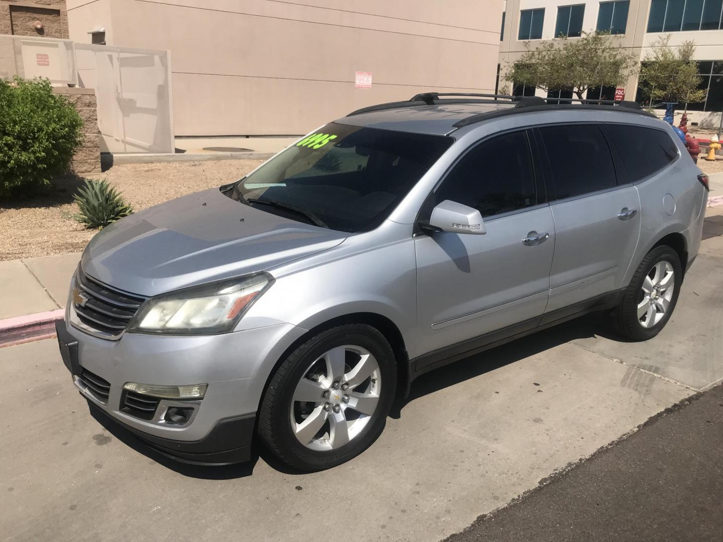 2014 silver /gray and black Chevrolet Traverse LTZ FWD (1GNKRJKD1EJ) with an 3.6L V6 DOHC 24V engine, 6-Speed Automatic transmission, located at 323 E Dunlap Ave., Phoenix, AZ, 85020, (602) 331-9000, 33.567677, -112.069000 - 2014 Chevrolet Traverse LTZ 2WD,........Automatic with 3RD ROW SEATING, Cold A/C, Silver with black leather seats, Touch screen Stereo, Bluetooth, Phone sync, Back-up camera, Satellite compatible, This family suv is in good condition, Clean title , .....passed emissions.....Call or text Dave 602-3 - Photo#1
