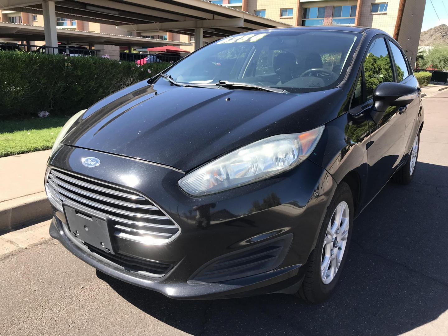2016 black /gray Ford Fiesta SE Hatchback (3FADP4EJ6GM) with an 1.6L L4 DOHC 16V engine, automatic transmission, located at 323 E Dunlap Ave., Phoenix, AZ, 85020, (602) 331-9000, 33.567677, -112.069000 - 2016 Ford Fiesta SE,.....A Must See!!...Automatic, 1.6L Engine, Super Economical -- 160k miles .... Ice cold AC. The car is gorgeous inside and out. Power windows, Power door locks, Stereo/ CD Player, Phone sync, Bluetooth, Beautiful black exterior with gray cloth seats in near perfect condition, Cl - Photo#0