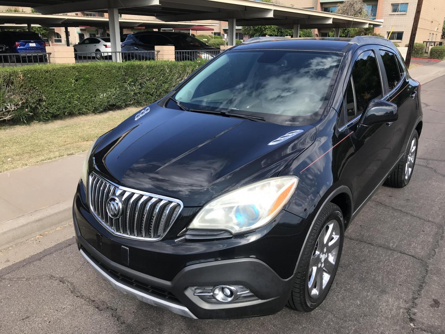 2013 black /black Buick Encore Leather FWD (KL4CJCSB7DB) with an 1.4L L4 DOHC 16V TURBO engine, 6-Speed Automatic transmission, located at 323 E Dunlap Ave., Phoenix, AZ, 85020, (602) 331-9000, 33.567677, -112.069000 - 2013 BUICK ENCORE SUV ........ Automatic, 1.4T Engine, 156k miles, Cold AC. Power Options, Premium Sound Stereo/ CD Player, Beautiful Black Exterior with black leather seats, Backup Camera, Alloy Wheels, Clean title , Runs and Drives great . passed emissions. Priced at $7495 ..... Great Economical - Photo#1
