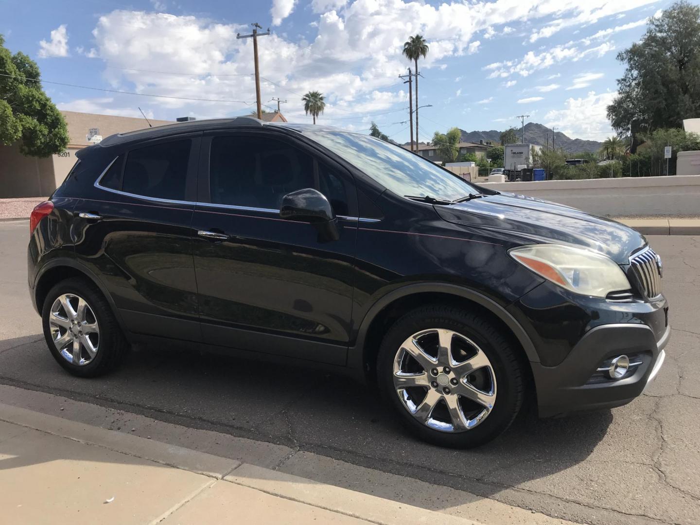 2013 black /black Buick Encore Leather FWD (KL4CJCSB7DB) with an 1.4L L4 DOHC 16V TURBO engine, 6-Speed Automatic transmission, located at 323 E Dunlap Ave., Phoenix, AZ, 85020, (602) 331-9000, 33.567677, -112.069000 - 2013 BUICK ENCORE SUV ........ Automatic, 1.4T Engine, 156k miles, Cold AC. Power Options, Premium Sound Stereo/ CD Player, Beautiful Black Exterior with black leather seats, Backup Camera, Alloy Wheels, Clean title , Runs and Drives great . passed emissions. Priced at $7495 ..... Great Economical - Photo#6