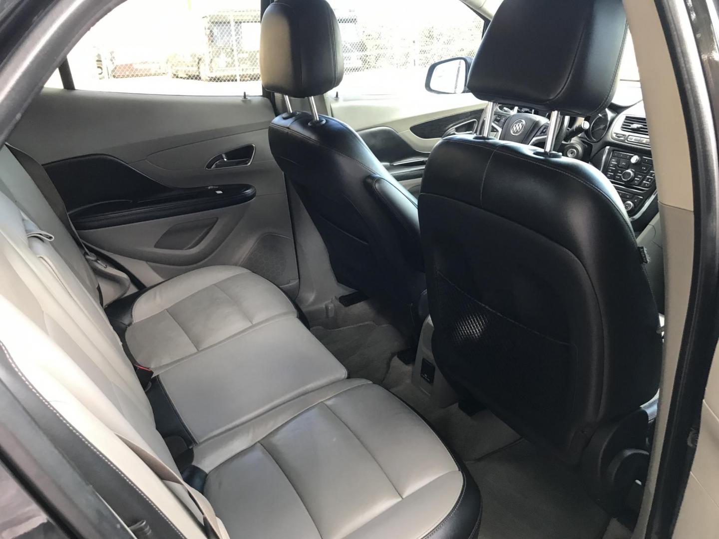 2013 black /black Buick Encore Leather FWD (KL4CJCSB7DB) with an 1.4L L4 DOHC 16V TURBO engine, 6-Speed Automatic transmission, located at 323 E Dunlap Ave., Phoenix, AZ, 85020, (602) 331-9000, 33.567677, -112.069000 - 2013 BUICK ENCORE SUV ........ Automatic, 1.4T Engine, 156k miles, Cold AC. Power Options, Premium Sound Stereo/ CD Player, Beautiful Black Exterior with black leather seats, Backup Camera, Alloy Wheels, Clean title , Runs and Drives great . passed emissions. Priced at $7495 ..... Great Economical - Photo#9