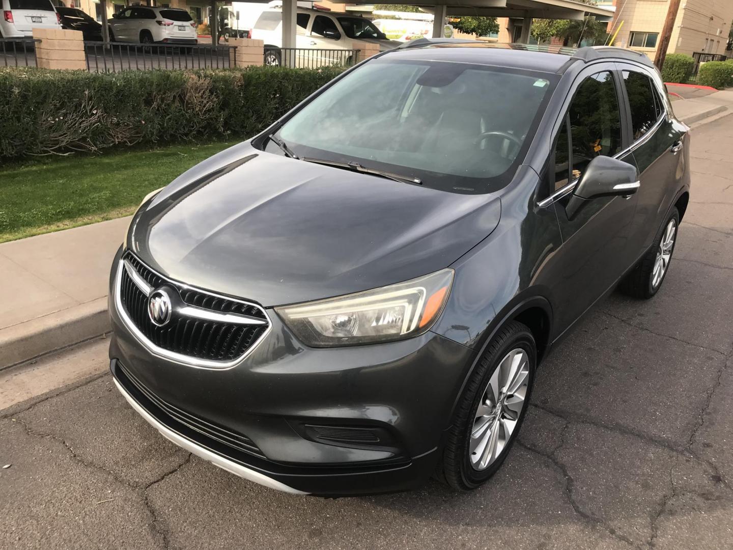 2017 gray /gray and black Buick Encore Preferred FWD (KL4CJASBXHB) with an 1.4L L4 DOHC 16V TURBO engine, 6A transmission, located at 323 E Dunlap Ave., Phoenix, AZ, 85020, (602) 331-9000, 33.567677, -112.069000 - 2017 BUICK ENCORE SUV ........ Automatic, 1.4T Engine, with LOW 125k miles, Cold AC. Power Options, Premium Sound Stereo/ CD Player, Beautiful Gray Exterior with black leather seats, Backup Camera, Alloy Wheels, Clean title , Runs and Drives great . passed emissions. Priced to sell @ $7000 CASH PRIC - Photo#1