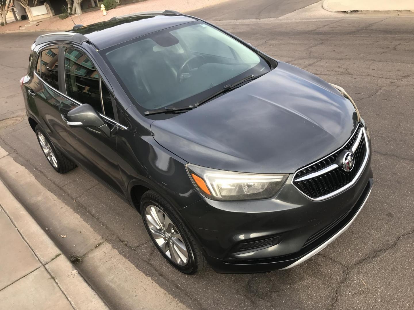 2017 gray /gray and black Buick Encore Preferred FWD (KL4CJASBXHB) with an 1.4L L4 DOHC 16V TURBO engine, 6A transmission, located at 323 E Dunlap Ave., Phoenix, AZ, 85020, (602) 331-9000, 33.567677, -112.069000 - 2017 BUICK ENCORE SUV ........ Automatic, 1.4T Engine, with LOW 125k miles, Cold AC. Power Options, Premium Sound Stereo/ CD Player, Beautiful Gray Exterior with black leather seats, Backup Camera, Alloy Wheels, Clean title , Runs and Drives great . passed emissions. Priced to sell @ $7000 CASH PRIC - Photo#5