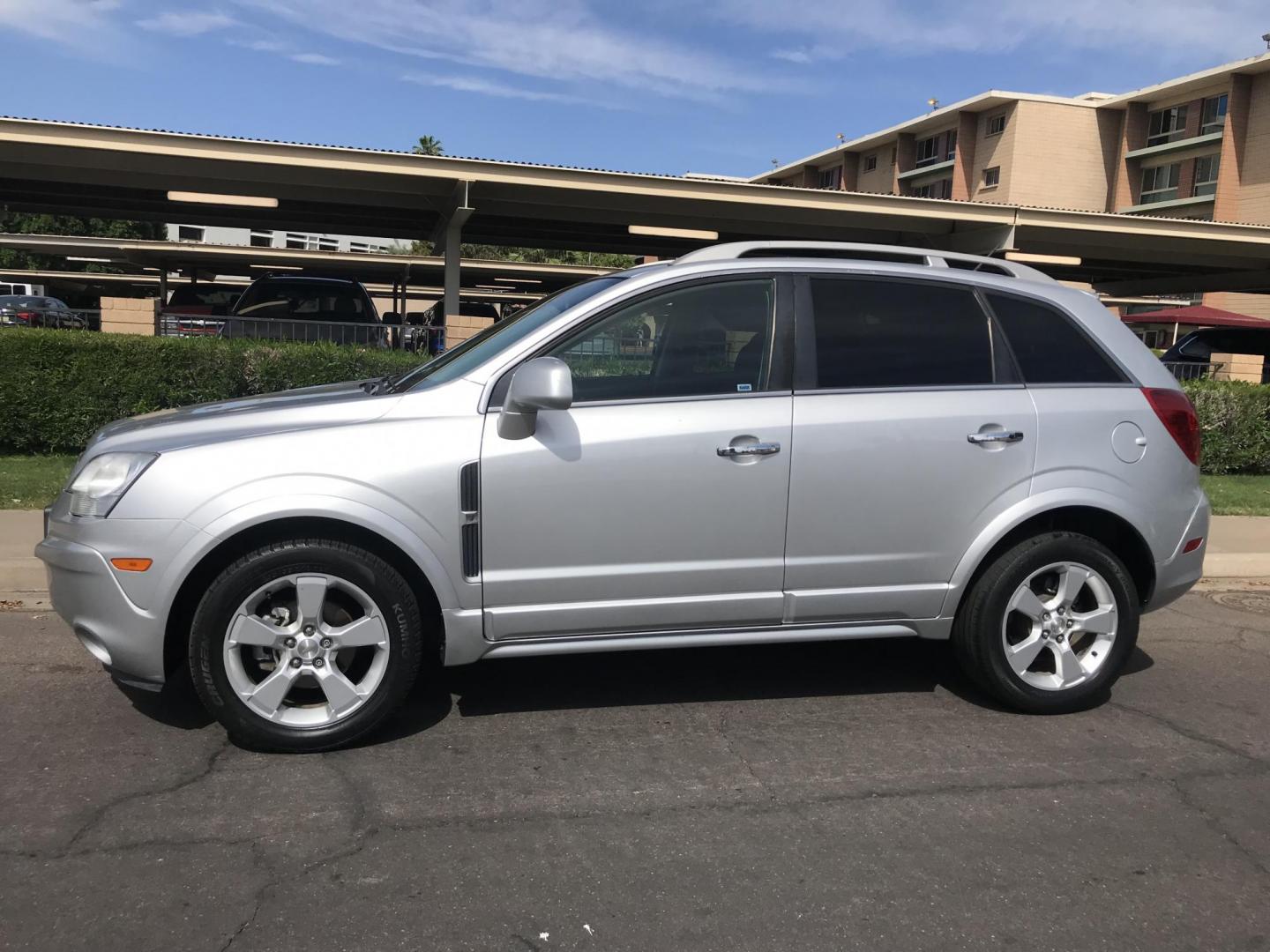 2014 silver /gray Chevrolet Captiva Sport 1LT FWD (3GNAL3EKXES) with an 2.4L L4 DOHC 16V FFV engine, 6-Speed Automatic transmission, located at 323 E Dunlap Ave., Phoenix, AZ, 85020, (602) 331-9000, 33.567677, -112.069000 - 2014 Chevrolet Captiva 1LT FWD ,.......LOW 123k original miles, great condition,.... Ice Cold A/C, Silver with gray interior cloth seats in near perfect condition, Power Options, Premium Sound CD, This suv is gorgeous inside and out, Incredible gas mileage! Arizona title , Runs and Drives great..... - Photo#2
