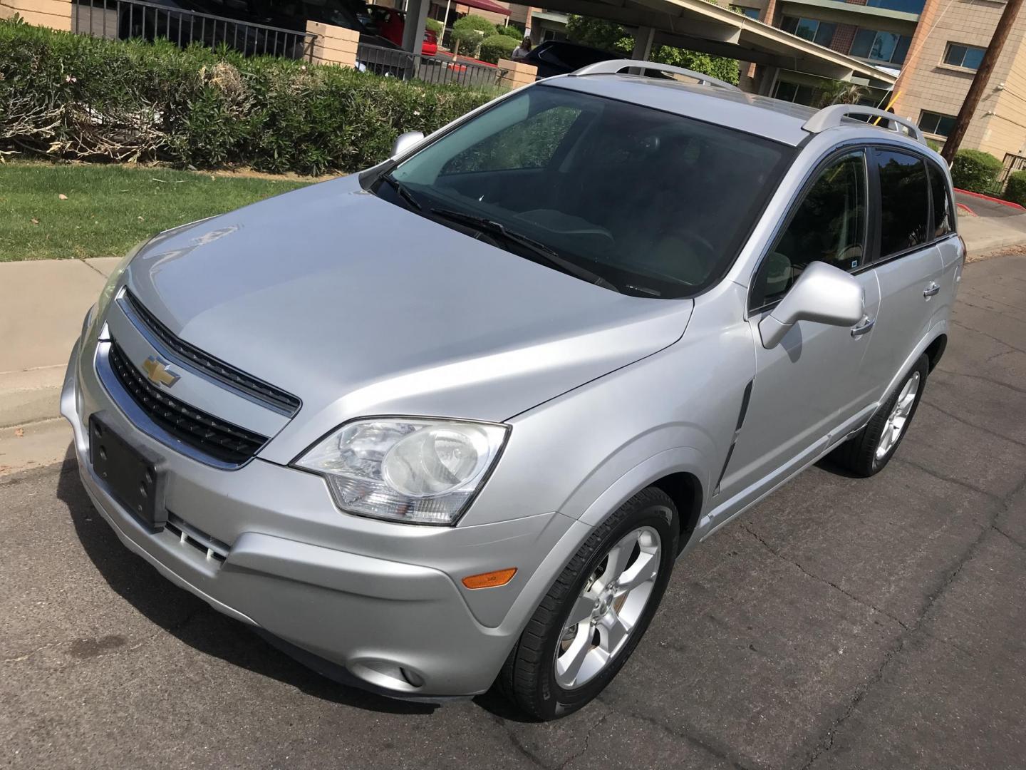 2014 silver /gray Chevrolet Captiva Sport 1LT FWD (3GNAL3EKXES) with an 2.4L L4 DOHC 16V FFV engine, 6-Speed Automatic transmission, located at 323 E Dunlap Ave., Phoenix, AZ, 85020, (602) 331-9000, 33.567677, -112.069000 - 2014 Chevrolet Captiva 1LT FWD ,.......LOW 123k original miles, great condition,.... Ice Cold A/C, Silver with gray interior cloth seats in near perfect condition, Power Options, Premium Sound CD, This suv is gorgeous inside and out, Incredible gas mileage! Arizona title , Runs and Drives great..... - Photo#1
