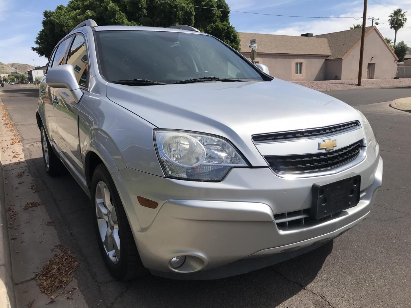 2014 silver /gray Chevrolet Captiva Sport 1LT FWD (3GNAL3EKXES) with an 2.4L L4 DOHC 16V FFV engine, 6-Speed Automatic transmission, located at 323 E Dunlap Ave., Phoenix, AZ, 85020, (602) 331-9000, 33.567677, -112.069000 - 2014 Chevrolet Captiva 1LT FWD ,.......LOW 123k original miles, great condition,.... Ice Cold A/C, Silver with gray interior cloth seats in near perfect condition, Power Options, Premium Sound CD, This suv is gorgeous inside and out, Incredible gas mileage! Arizona title , Runs and Drives great..... - Photo#4