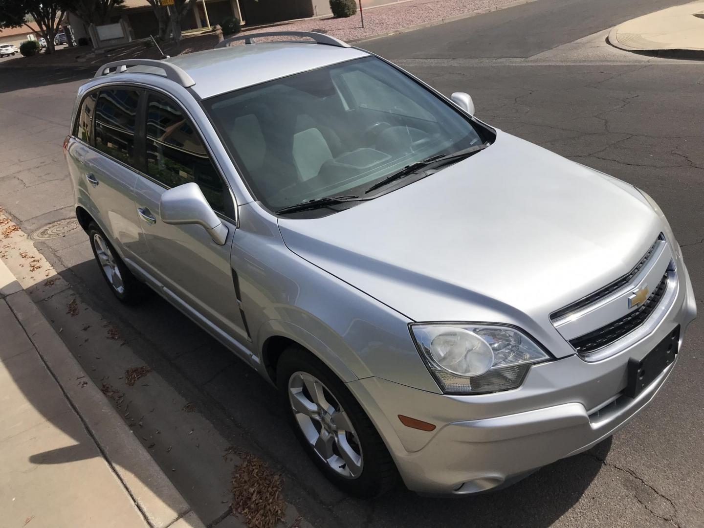 2014 silver /gray Chevrolet Captiva Sport 1LT FWD (3GNAL3EKXES) with an 2.4L L4 DOHC 16V FFV engine, 6-Speed Automatic transmission, located at 323 E Dunlap Ave., Phoenix, AZ, 85020, (602) 331-9000, 33.567677, -112.069000 - 2014 Chevrolet Captiva 1LT FWD ,.......LOW 123k original miles, great condition,.... Ice Cold A/C, Silver with gray interior cloth seats in near perfect condition, Power Options, Premium Sound CD, This suv is gorgeous inside and out, Incredible gas mileage! Arizona title , Runs and Drives great..... - Photo#5