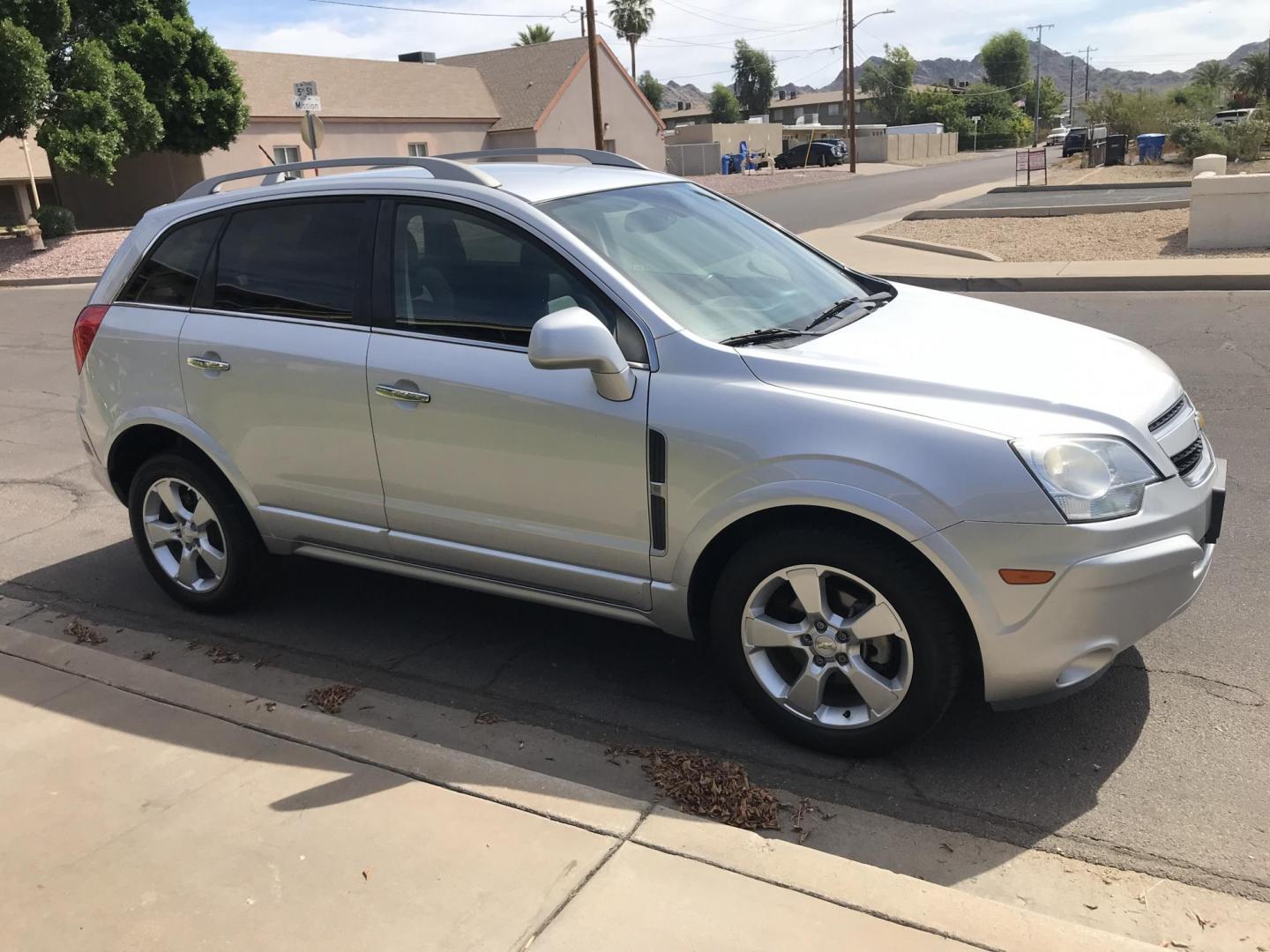 2014 silver /gray Chevrolet Captiva Sport 1LT FWD (3GNAL3EKXES) with an 2.4L L4 DOHC 16V FFV engine, 6-Speed Automatic transmission, located at 323 E Dunlap Ave., Phoenix, AZ, 85020, (602) 331-9000, 33.567677, -112.069000 - 2014 Chevrolet Captiva 1LT FWD ,.......LOW 123k original miles, great condition,.... Ice Cold A/C, Silver with gray interior cloth seats in near perfect condition, Power Options, Premium Sound CD, This suv is gorgeous inside and out, Incredible gas mileage! Arizona title , Runs and Drives great..... - Photo#6