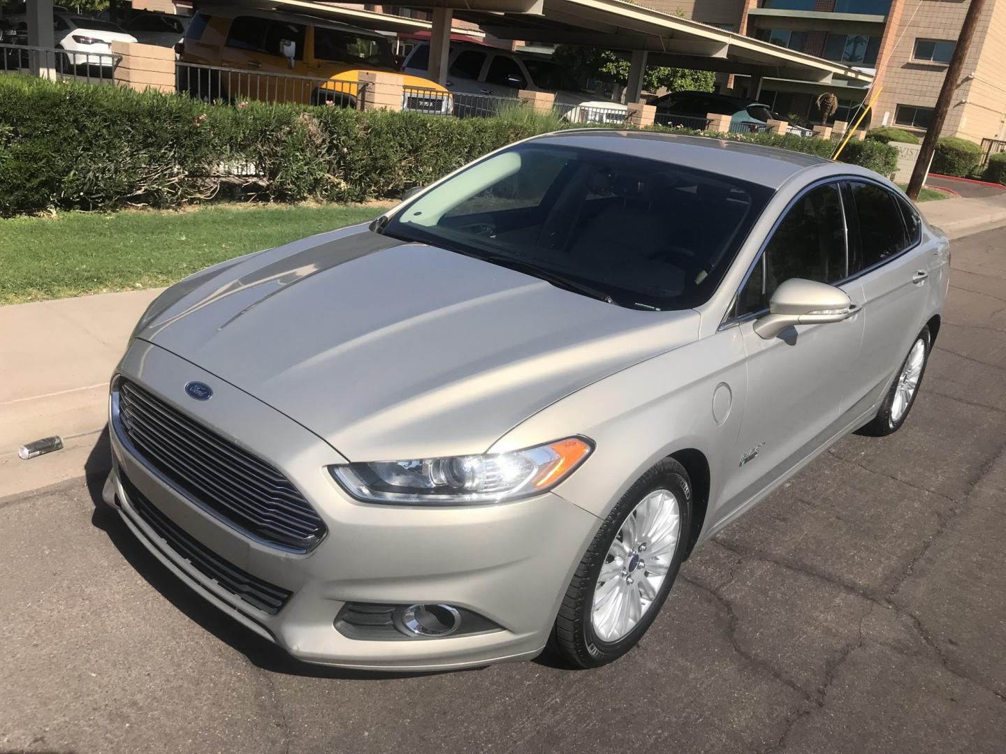 2015 gold /tan Ford Fusion Energi SE (3FA6P0PU9FR) with an 2.0L L4 DOHC 16V HYBRID engine, CVT transmission, located at 323 E Dunlap Ave., Phoenix, AZ, 85020, (602) 331-9000, 33.567677, -112.069000 - 2015 Ford Fusion HYBRID ,........GREAT condition, A Real Must See!!.... LOW 120k miles, Automatic, Power Options, Premium Sound CD, Ice cold ac, Clean gold exterior with beige seats, clean Arizona title, Runs and Drives Excellent. Very clean inside and out, SUPER ECONOMICAL Sedan, Any questions Call- Photo#1
