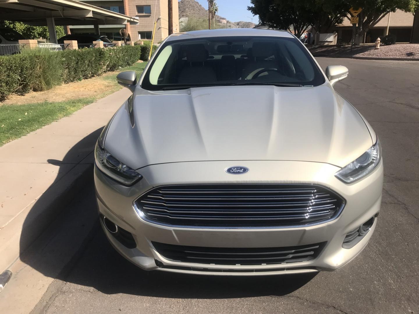 2015 gold /tan Ford Fusion Energi SE (3FA6P0PU9FR) with an 2.0L L4 DOHC 16V HYBRID engine, CVT transmission, located at 323 E Dunlap Ave., Phoenix, AZ, 85020, (602) 331-9000, 33.567677, -112.069000 - 2015 Ford Fusion HYBRID ,........GREAT condition, A Real Must See!!.... LOW 120k miles, Automatic, Power Options, Premium Sound CD, Ice cold ac, Clean gold exterior with beige seats, clean Arizona title, Runs and Drives Excellent. Very clean inside and out, SUPER ECONOMICAL Sedan, Any questions Call- Photo#3